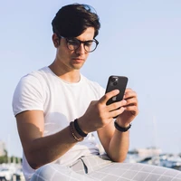 Spigen Glas.tR EZ Fit Optik Kameros apsauginis stiklas iPhone 14 / Plus / 15 / Plus - juodas 2 vnt