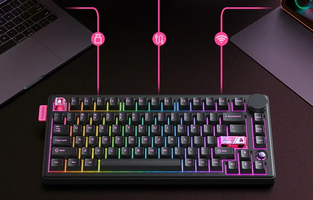 Black keyboard on table next to laptop and tablet