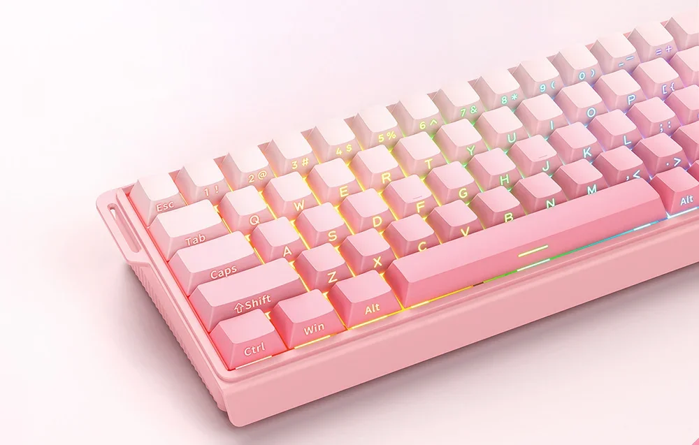 Pink keyboard with colorful backlight on pink background