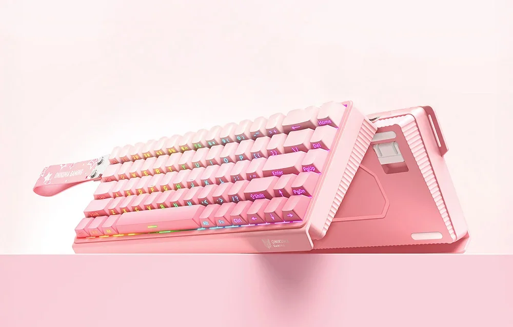 2 pink Onikuma gaming keyboards leaning against each other