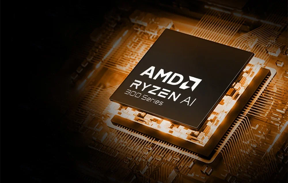 AMD Ryzen AI 300 Series processor on motherboard with orange backlighting and electronic details